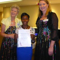 Hilary Lee (left) and Jane Verity (right) with Jesca Nakibirango on graduation day.